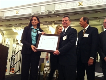 Susan Malish (L) presents to Stewart H. McCutcheon with CIO of 2011 award.